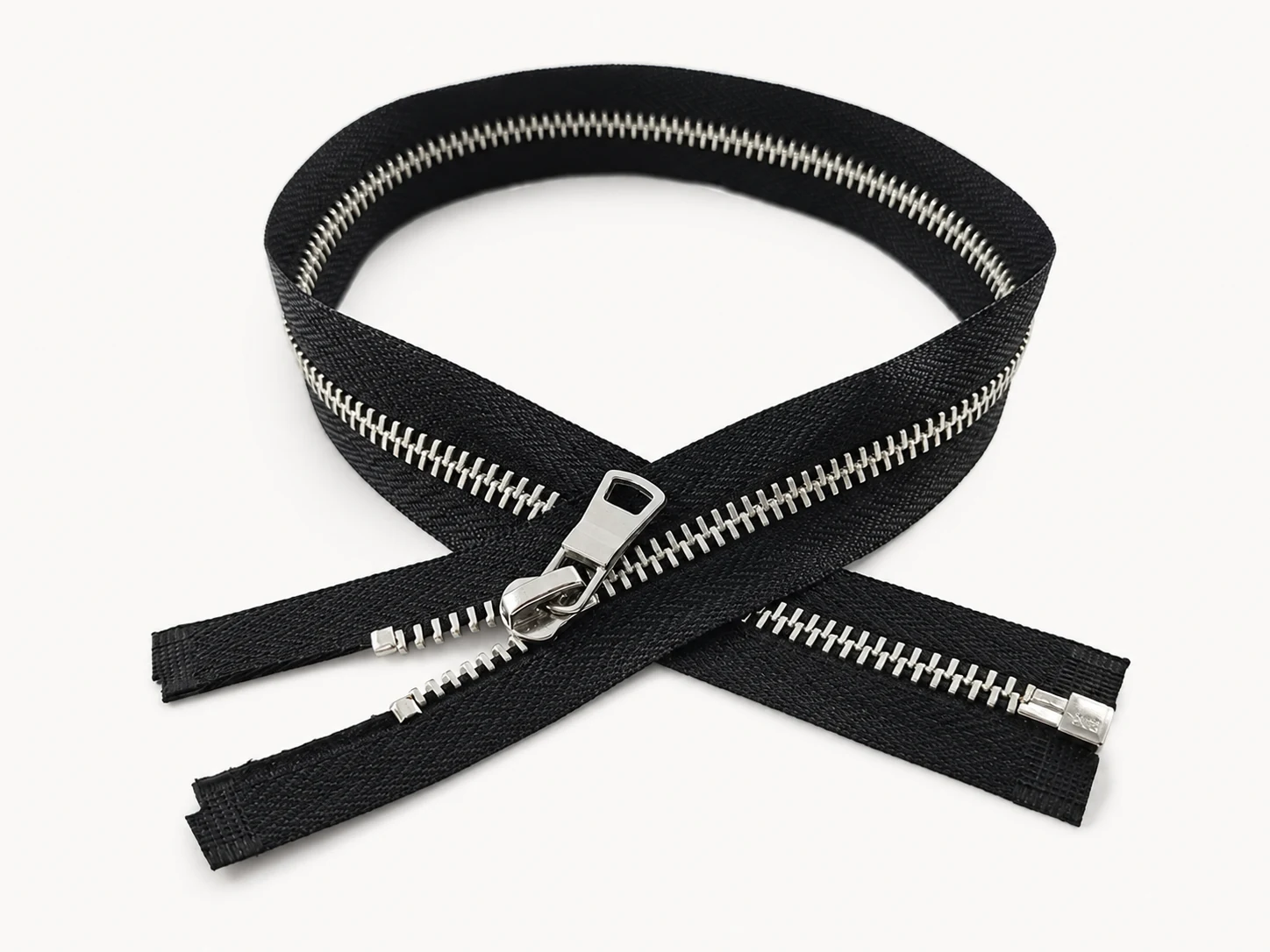 black metal zipper with polished silver teeth and auto lock slider