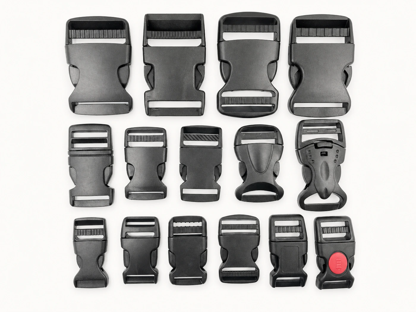Assorted black plastic side-release buckles in multiple sizes and styles