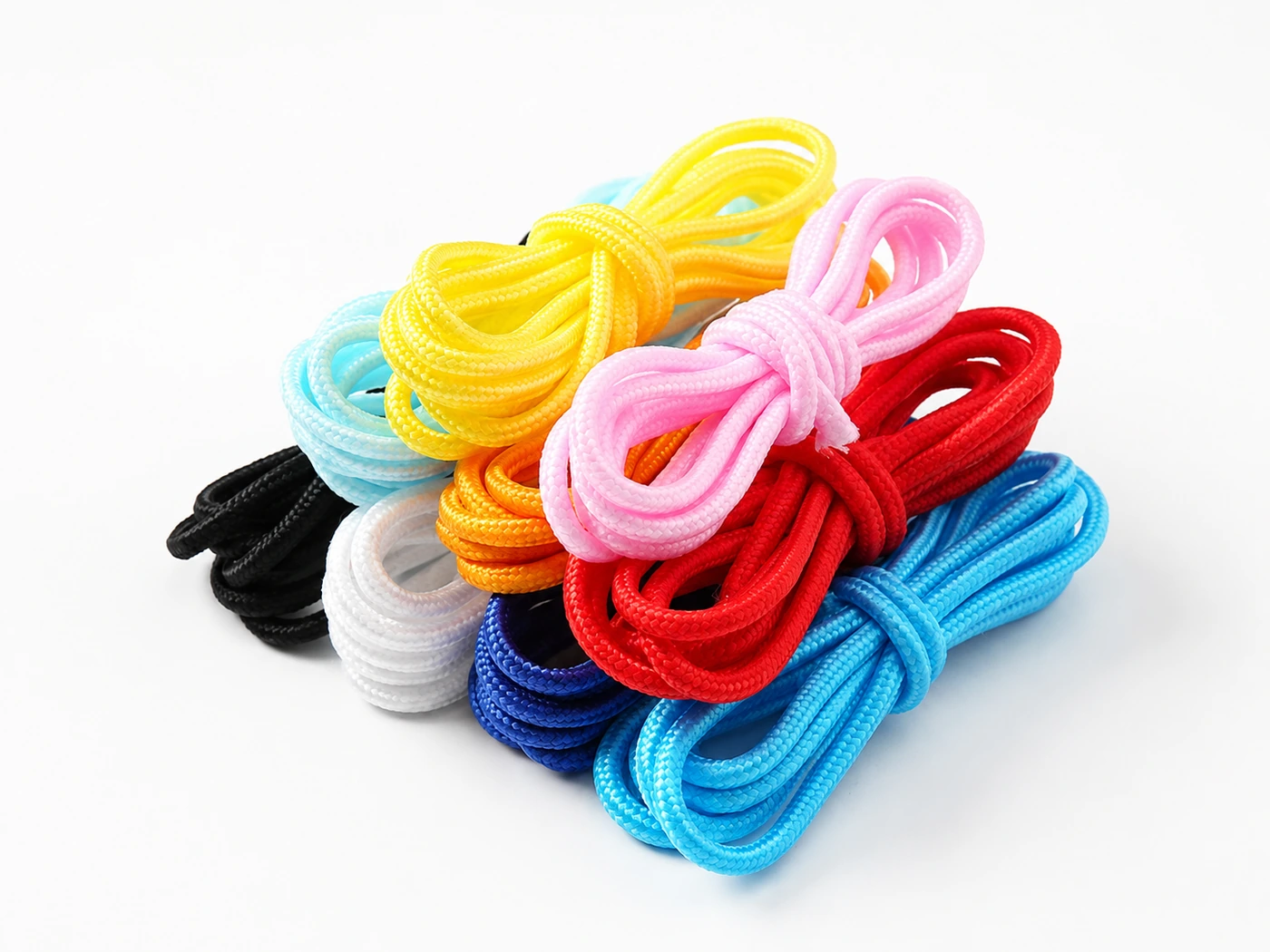 Brightly colored core-filled braided cords in small bundles